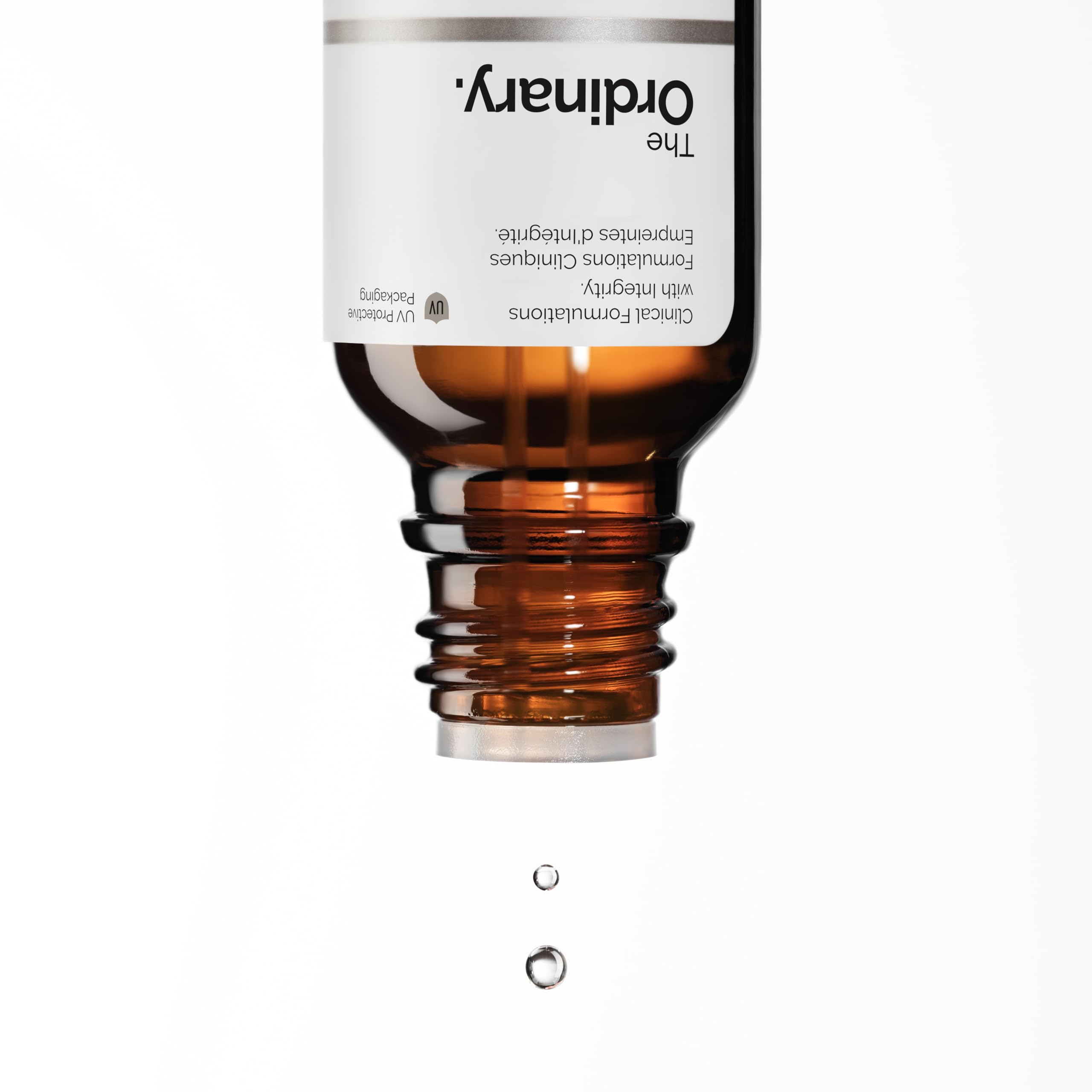 Bottle next to ruler for scale, showing The Ordinary 0.5 fl oz volume and travel-friendly convenience