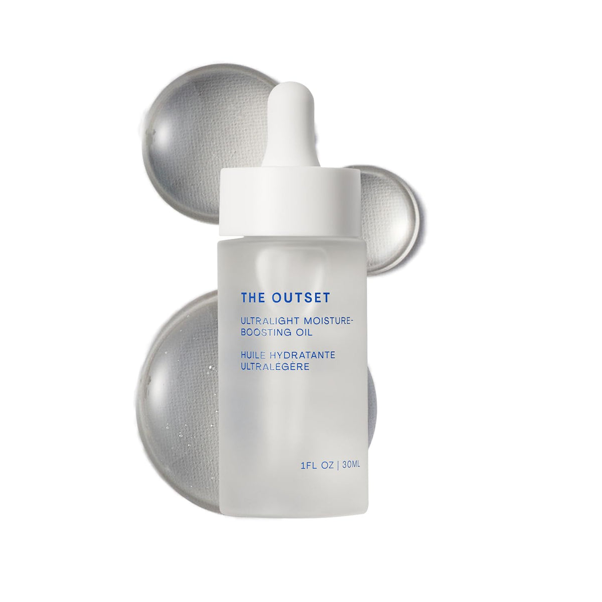 The Outset Ultralight Moisture Oil bottle closeup highlighting fast-absorbing hydration.