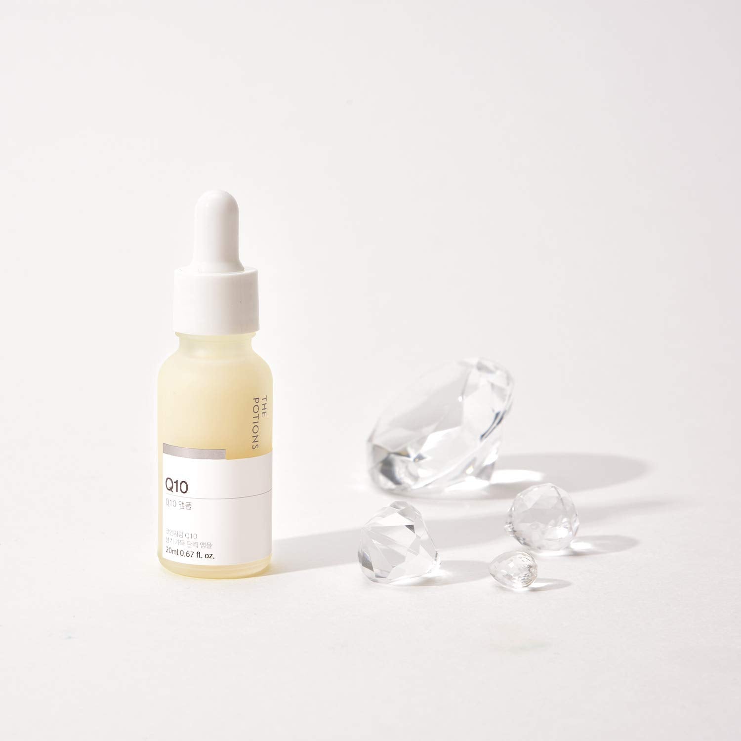 The Potions Coenzyme Q10 Face Serum for dry skin image conveys compact size and travel friendliness.