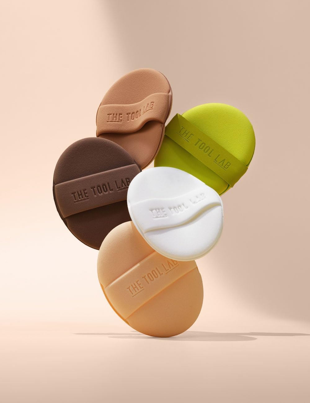 THE TOOL LAB glow-finish skin look achieved with the puff in use