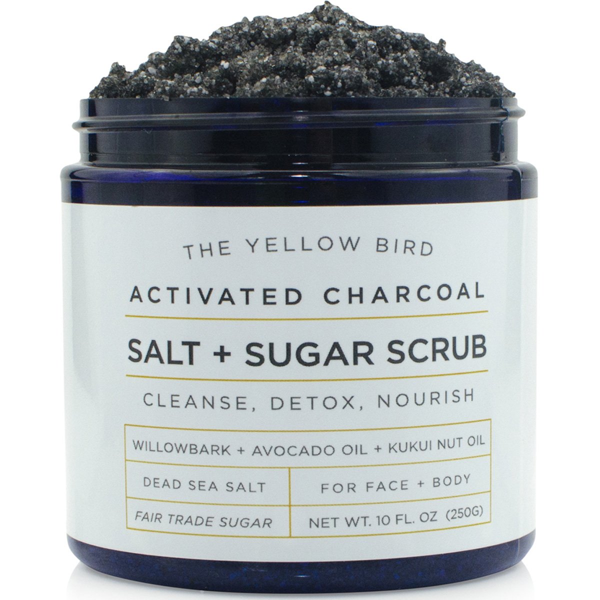 The Yellow Bird activated charcoal face scrub packaging highlights USA-made cleansing.