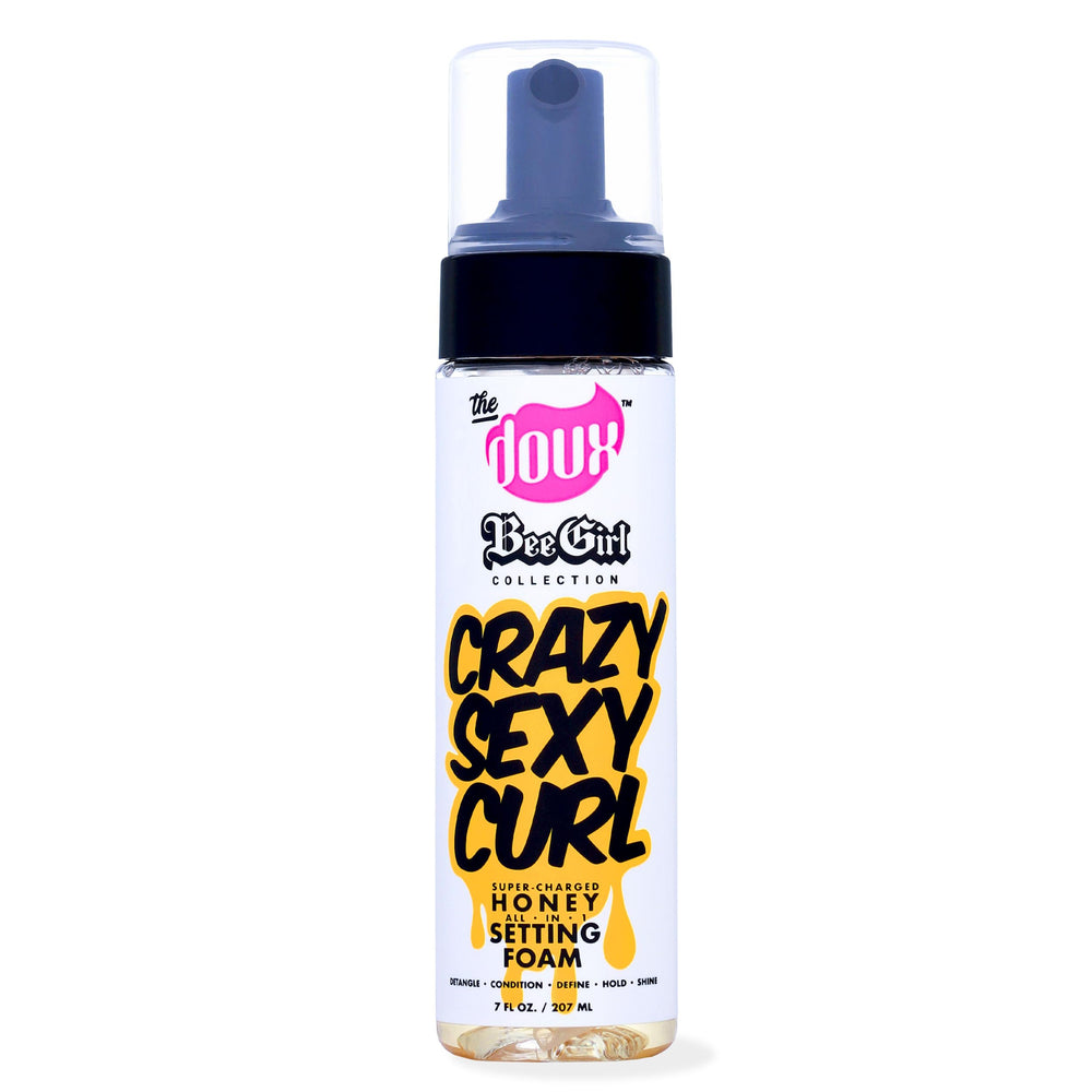 The Doux Curl Cream Setting Mousse packaging close-up highlighting frizz-control and moisture.