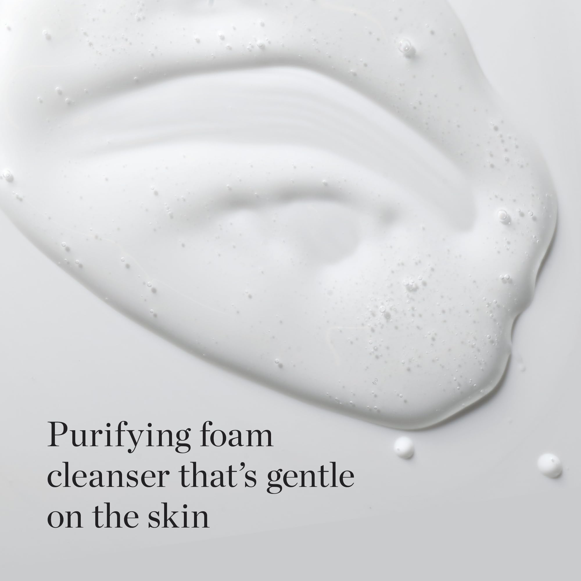 Foamy lather on hand demonstrating gentle cleansing from The Face Shop White Seed Exfoliating Cleansing Foam.