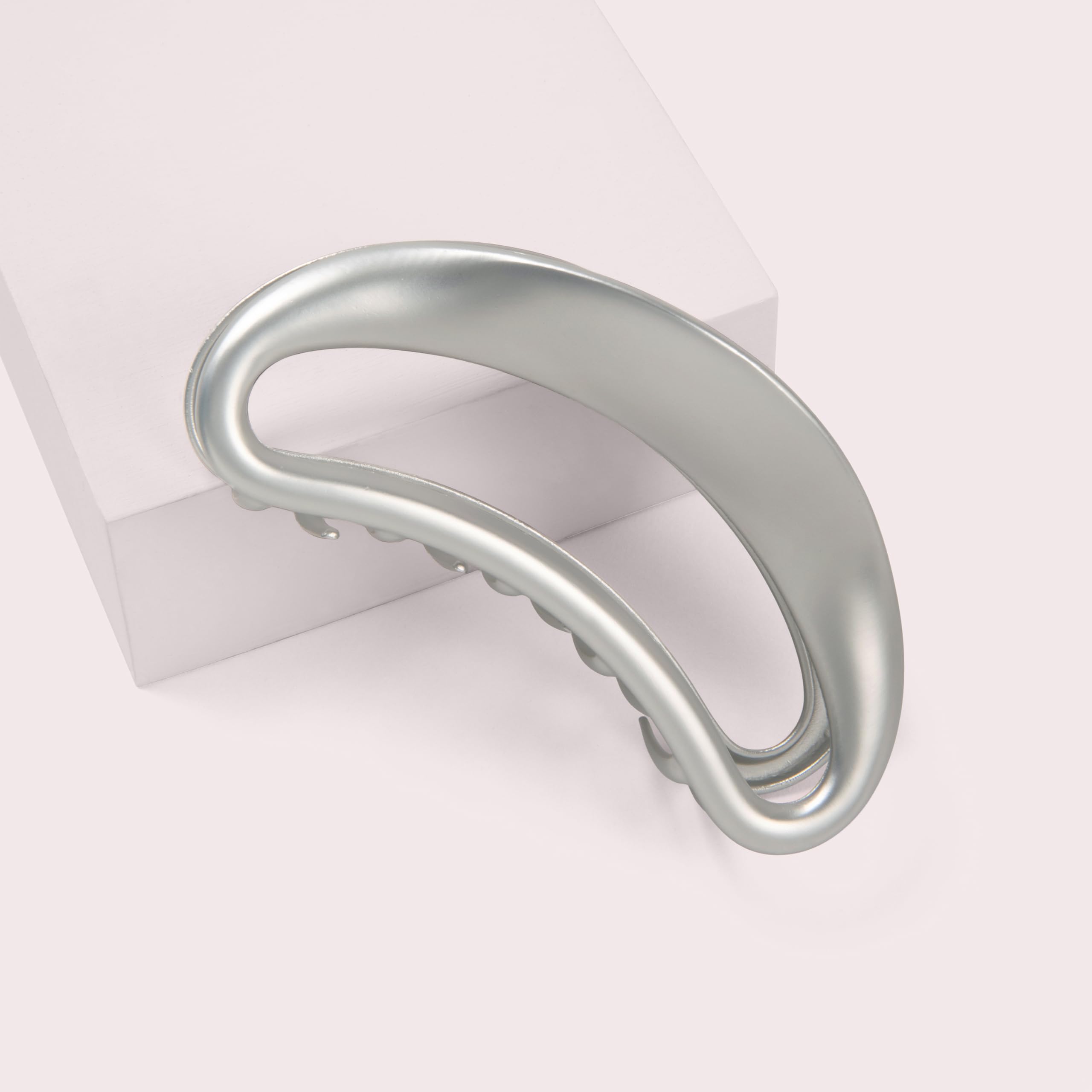 The Hair Edit Sculpted Silver Claw Clip half-up styling shows versatile, chic day-to-night wear.