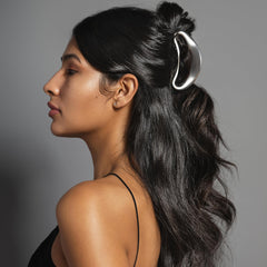 The Hair Edit Sculpted Silver Claw Clip in-use demonstrates easy up-do creation and secure hold.