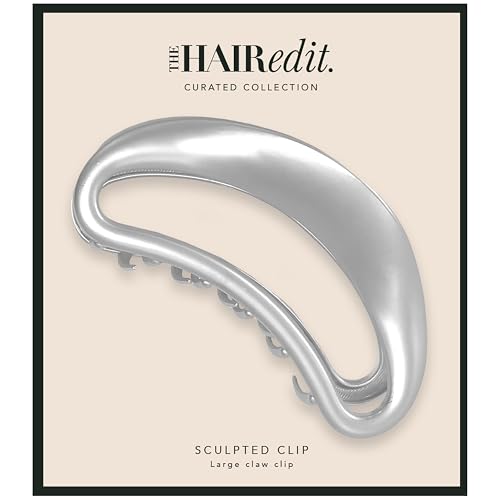 The Hair Edit Sculpted Silver Claw Clip side profile highlights its curved grip for secure half-ups.