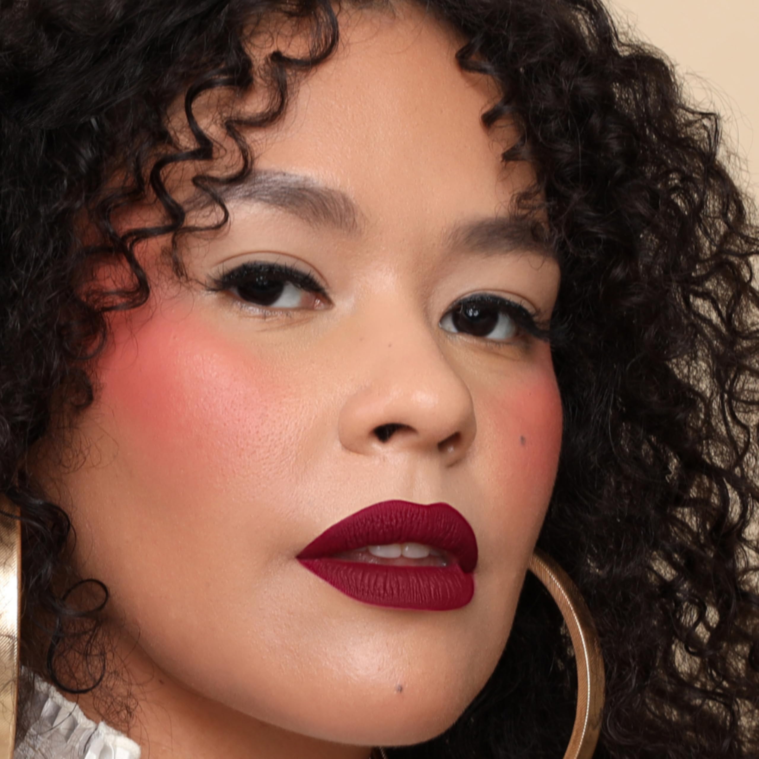 The Lip Bar Muse Deep Berry glam pout image suggests bold color for daily wear.