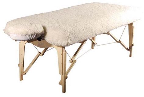 Therapist's Choice Deluxe fleece massage table pad topper wrapped around table edge for client comfort.