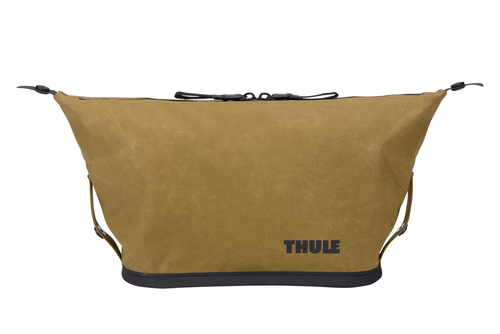 Thule Aion side flaps extended for added capacity while traveling.