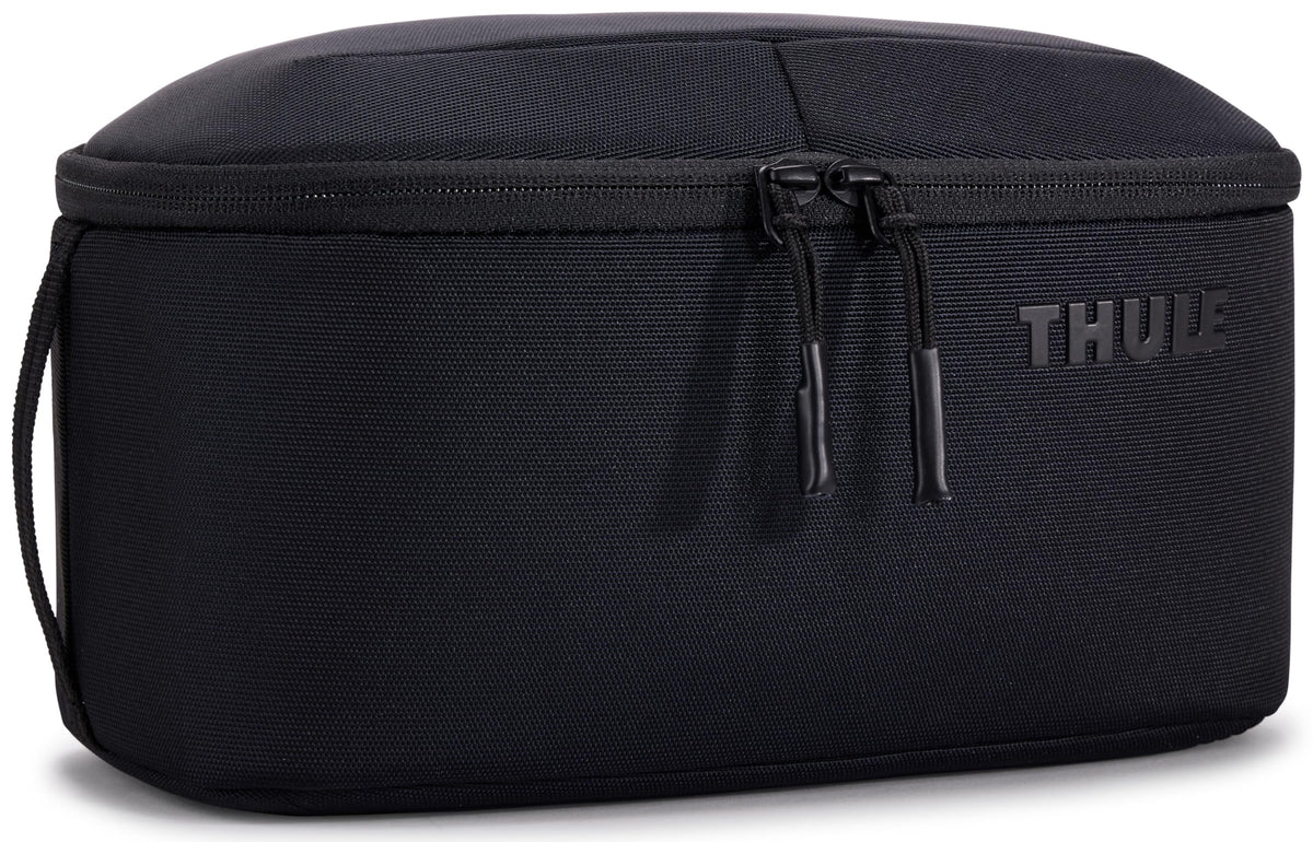 Thule Subterra 2 Toiletry Bag opens to reveal organized space for essentials during travel.