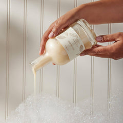 Thymes Bubble Bath Goldleaf creamy lather delivering a soothing, skin-nourishing soak.