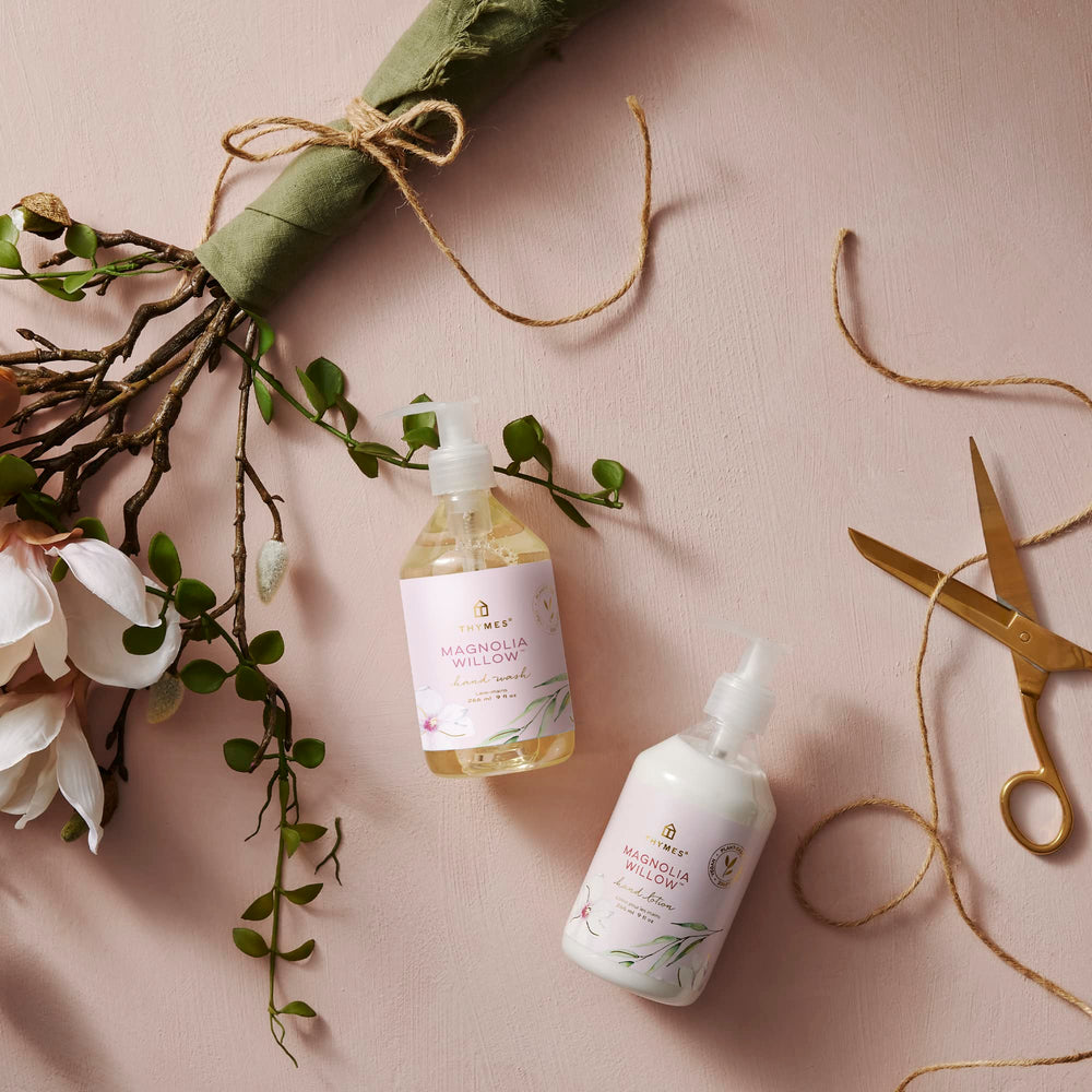 Thymes shea butter jar close-up highlights rich hydration for nourished skin.