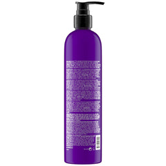 TIGI Bed Head Dumb Blonde purple-lather close-up shows conditioning and frizz control.