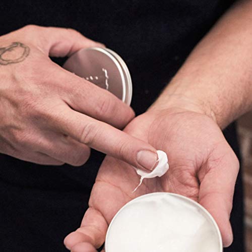 TIGI Bed Head for Men Texture Molding Paste on model demonstrates textured finish.