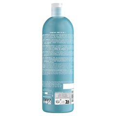 TIGI Bed Head Recovery Conditioner application image showing creamy formula softening damaged strands.