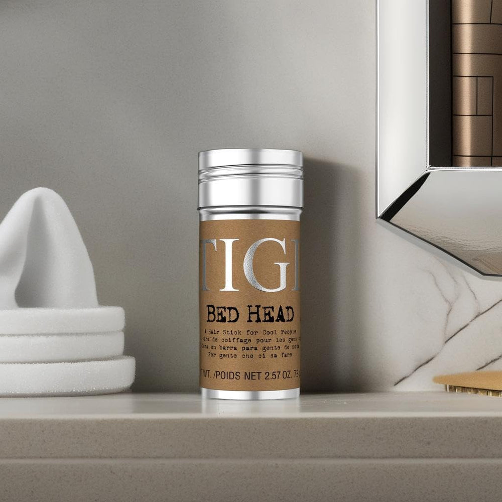 TIGI Bed Head Wax Stick gloss boost and smooth glide on dry hair.