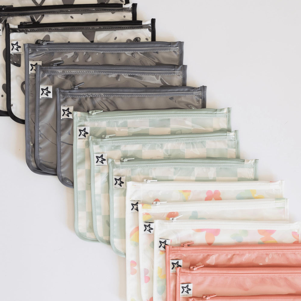 Tiny Twinkle travel-ready pouch set stores toiletries and baby items for on-the-go.