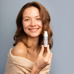 TIZO Eye Renewal SPF20 texture swatch on skin showing silky, invisible feel