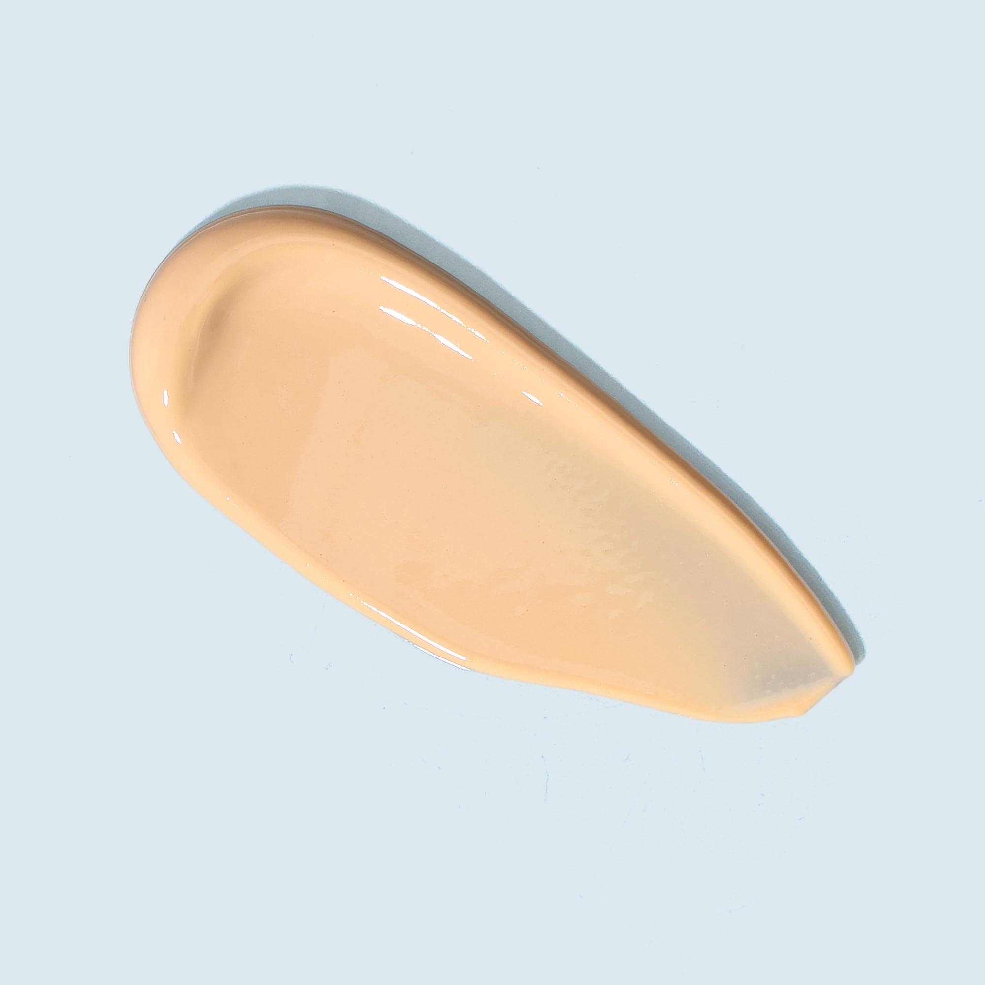 TIZO Ultra Zinc tinted sunscreen being applied for dewy, even coverage.
