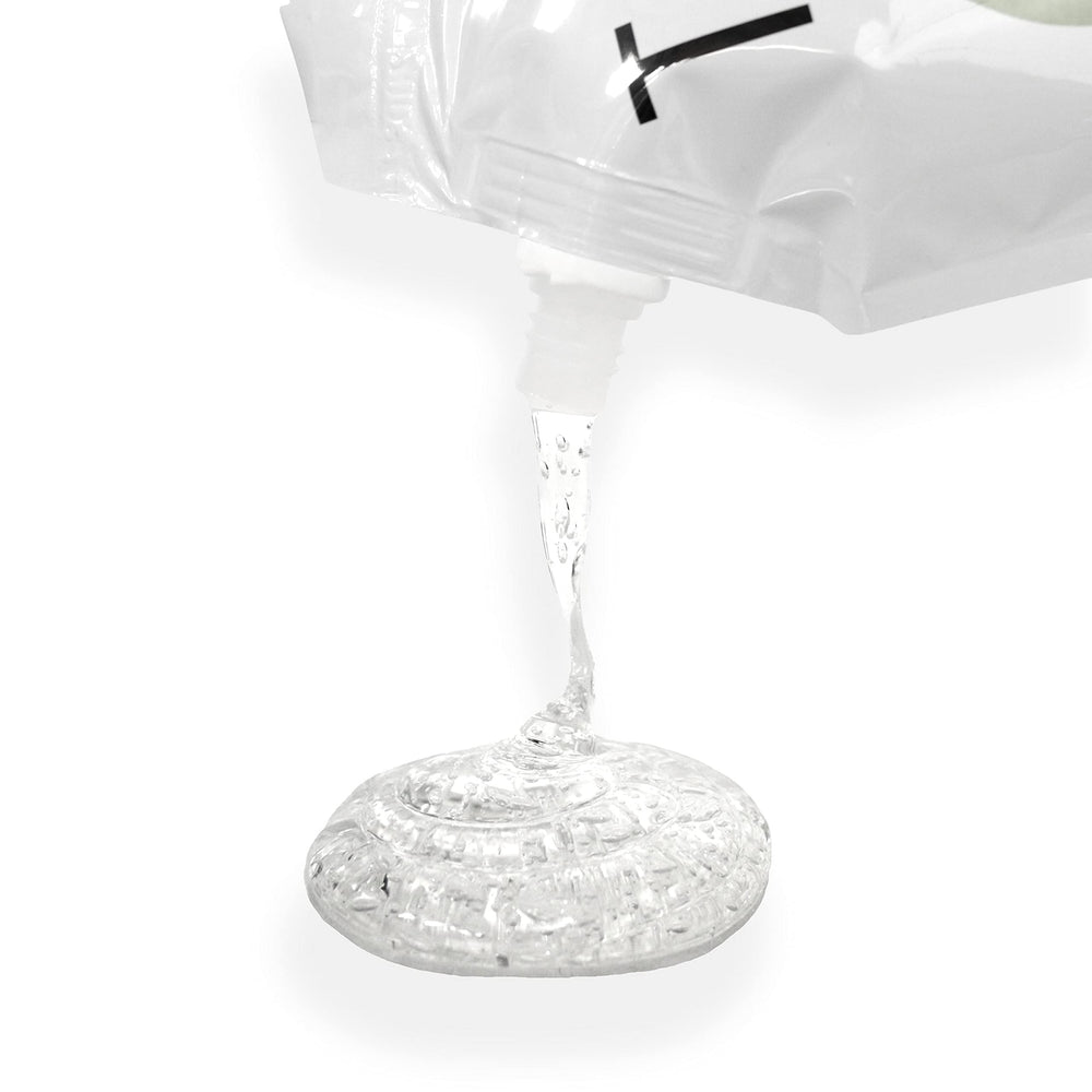 TKB Lip Gloss Base clear bottle close-up demonstrating smooth, heat-free blending for custom shades