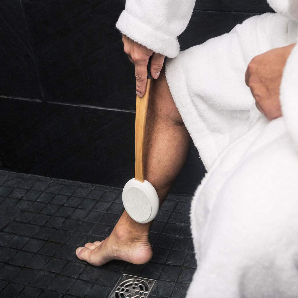 Toem lotion applicator hook-storage keeps bathroom organized after use.