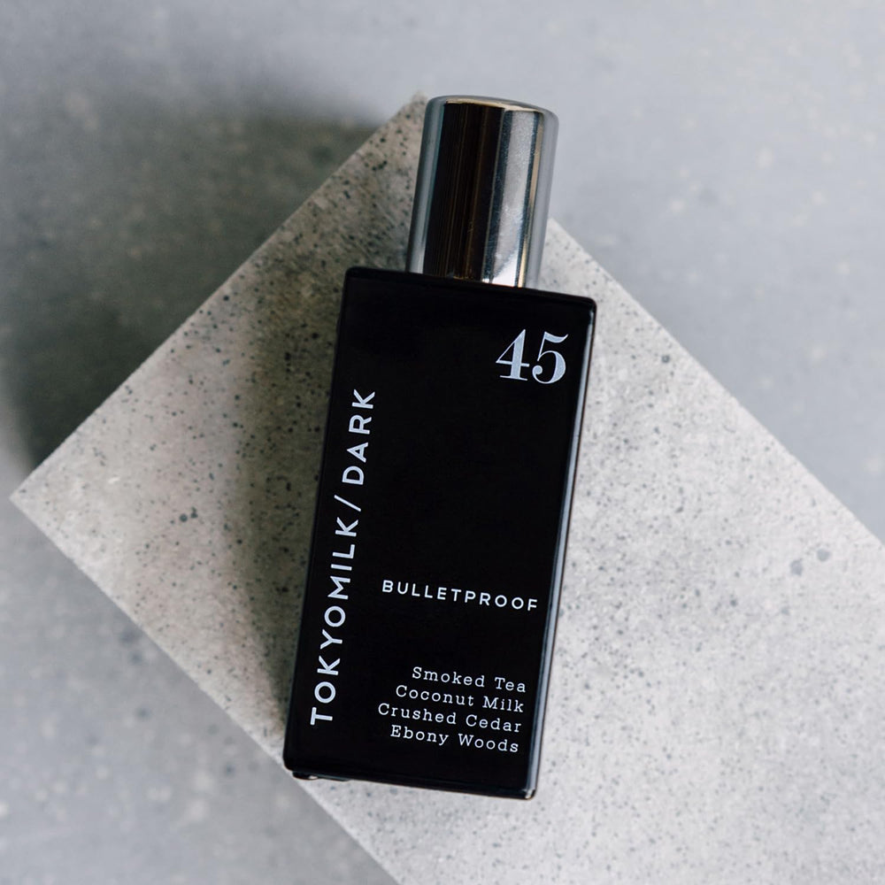 TOKYOMILK Dark Bulletproof ebony wood scent evokes forest mood.