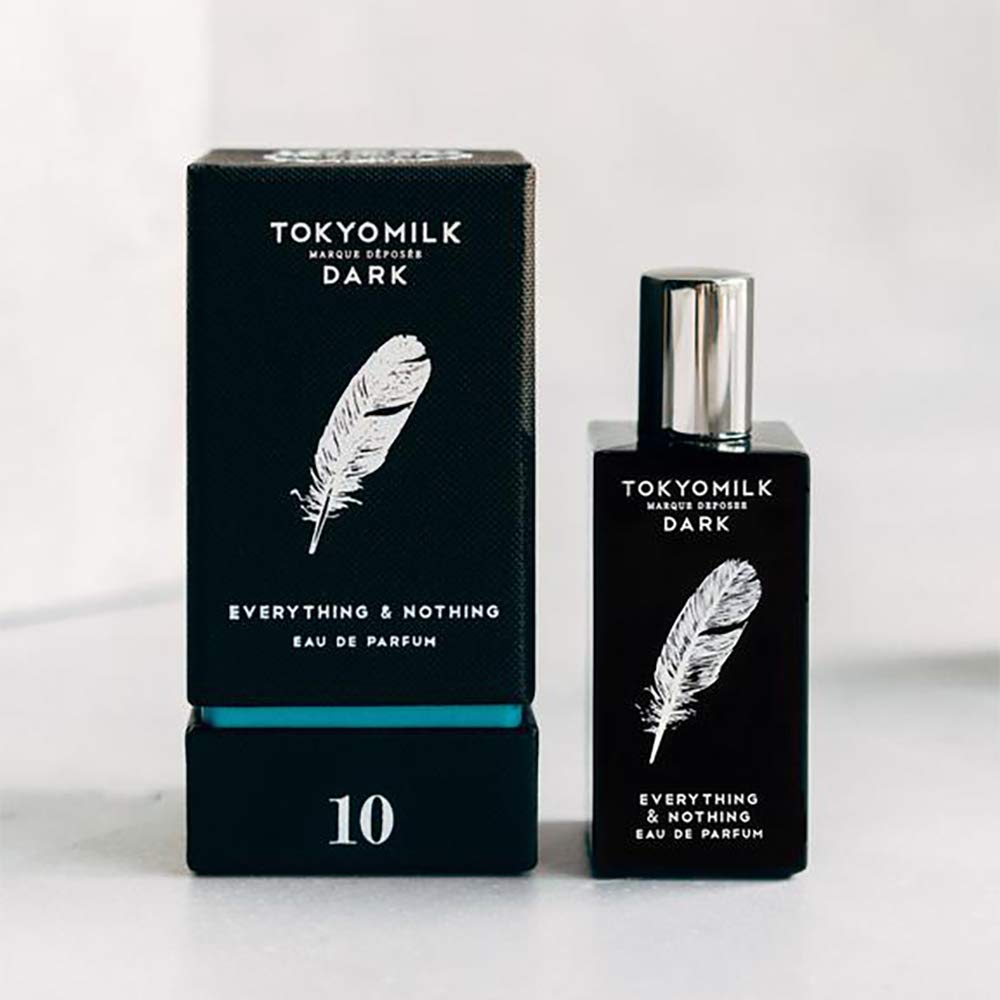 TOKYOMILK Dark Everything and Nothing lifestyle shot suggests timeless wearable fragrance.