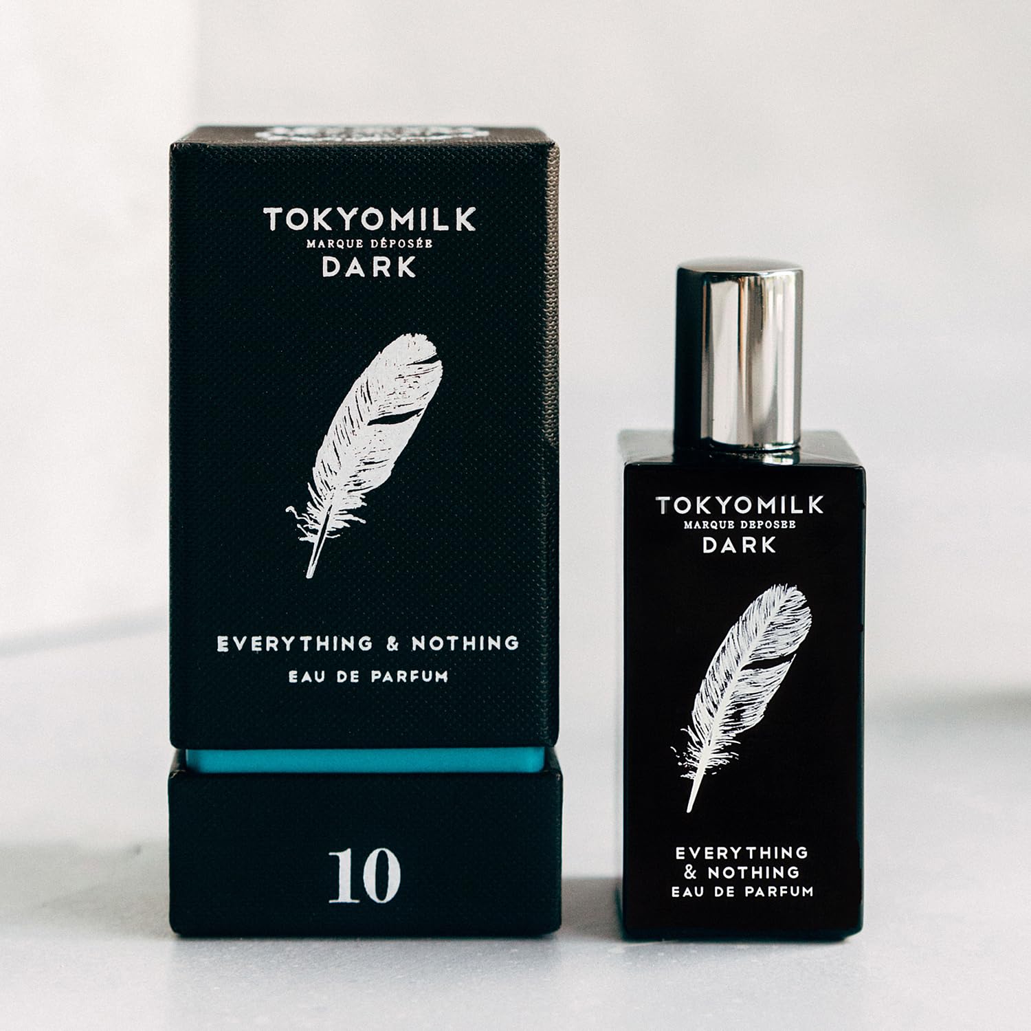 TOKYOMILK Dark Everything and Nothing spray at pulse points for lasting aroma.