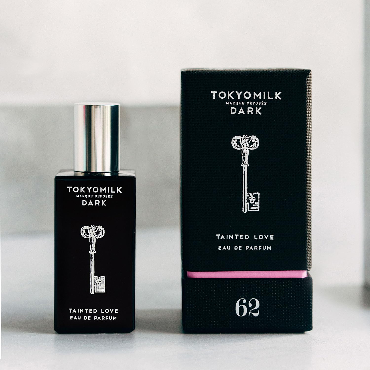 TOKYOMILK Dark Tainted Love application pulse point suggests long-lasting presence.