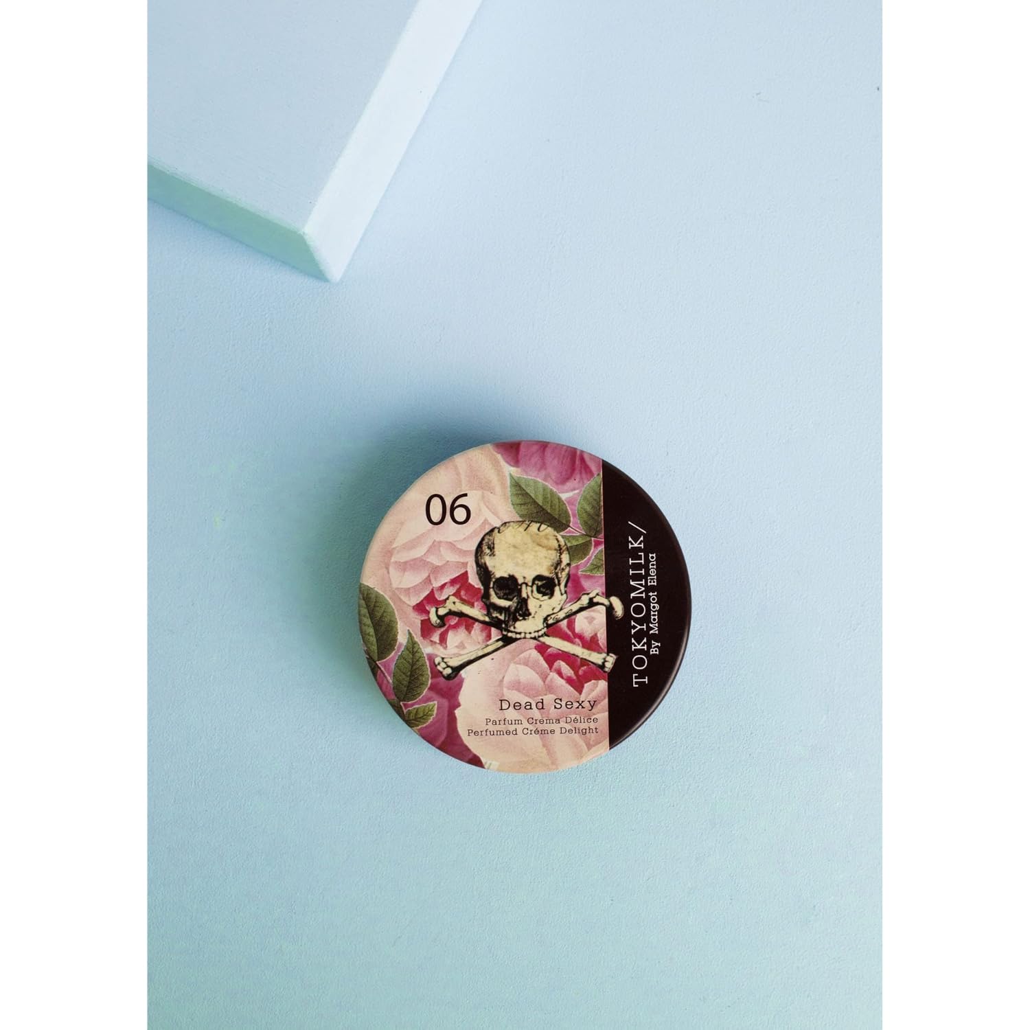 TOKYOMILK Dead Sexy Parfum Crema fragrance-note-visual highlights vanilla, orchid, and ebony wood.