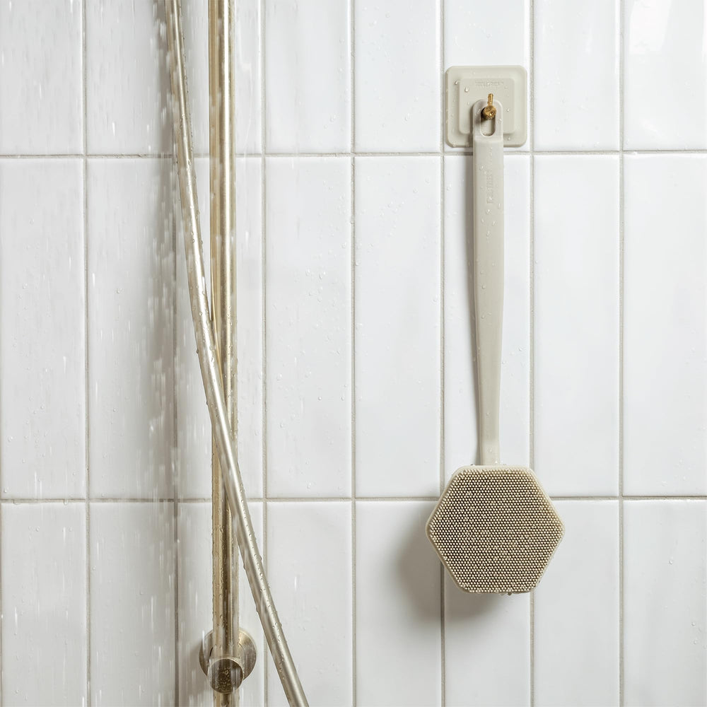 TOOLETRIES silicone back scrubber can be used on glass surfaces for easy rinse