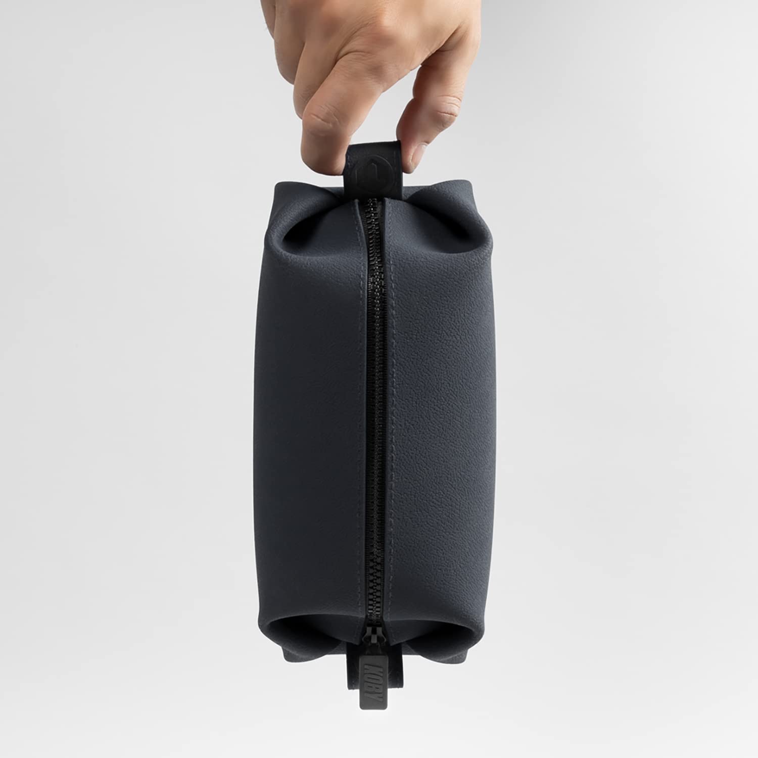 TOOLETRIES Koby Lite Dopp Kit charcoal color adds sleek style to bags.