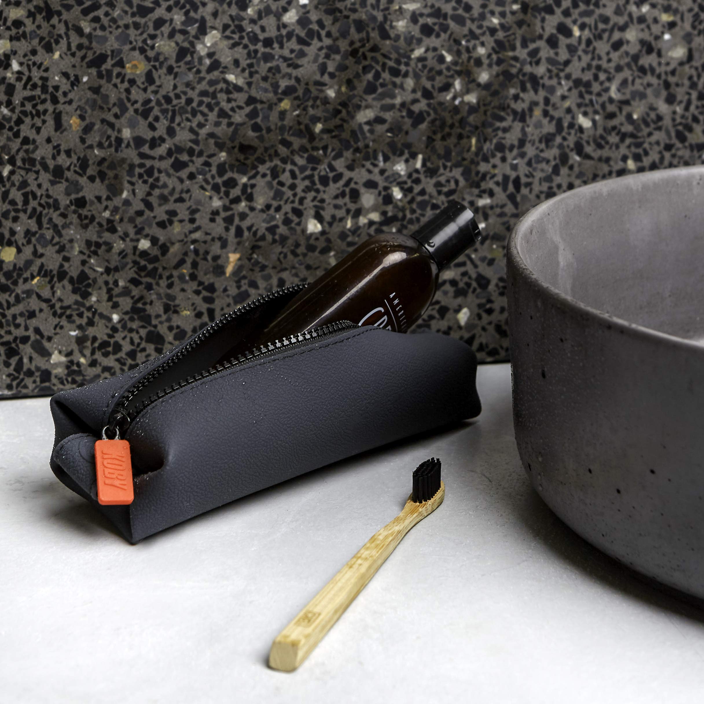 TOOLETRIES Koby Mini silicone durability supports long-term travel use.