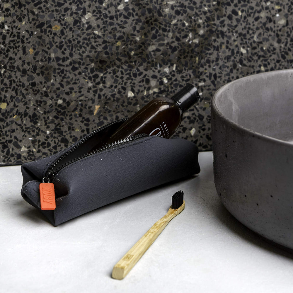 TOOLETRIES Koby Mini silicone durability supports long-term travel use.