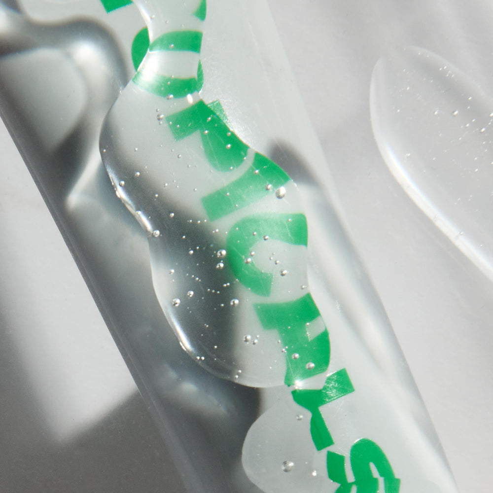 Topicals Slick Salve Mint Glossy Lip Balm tube on-the-go for durable moisture.