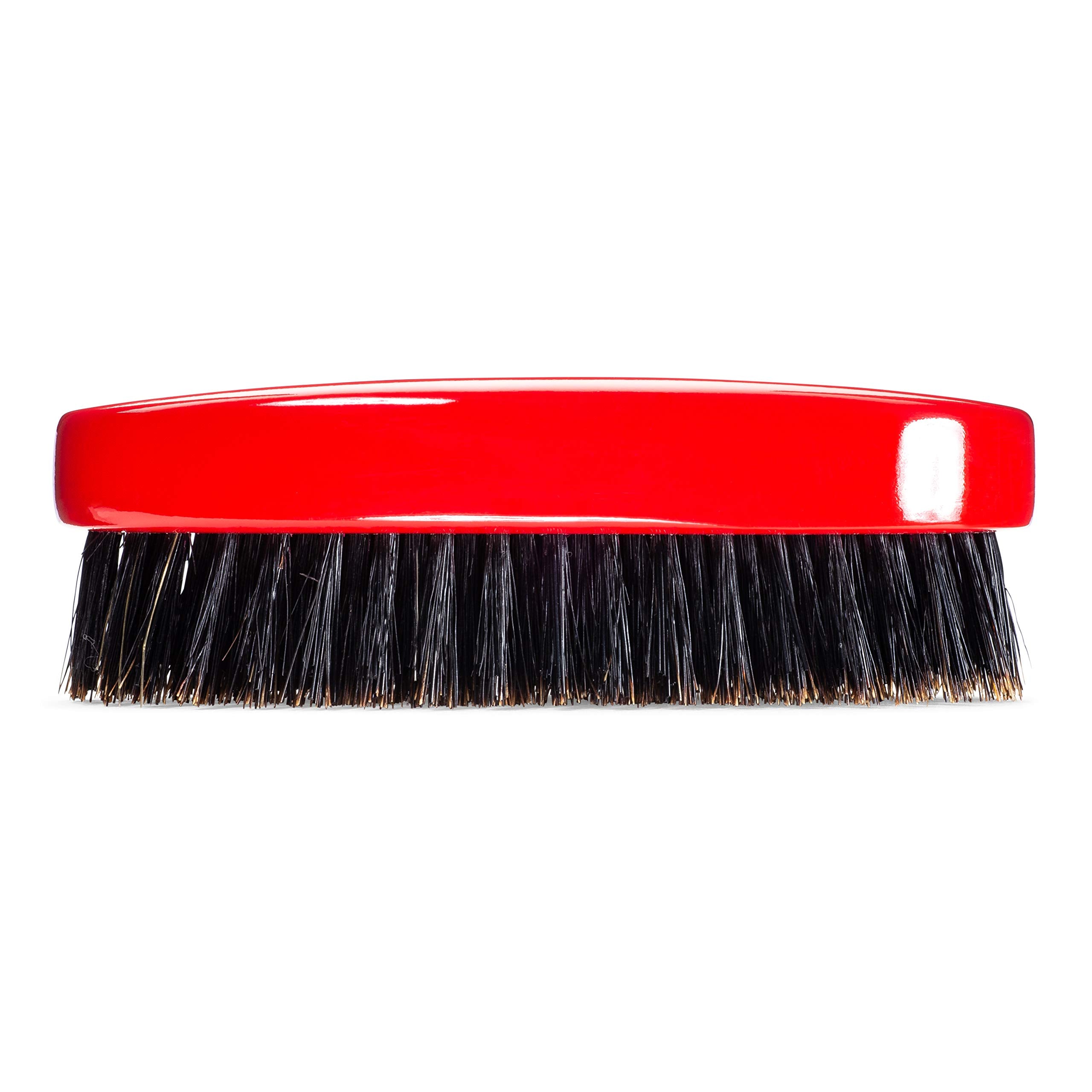 Torino Pro Wave Brush in hand demonstrates ergonomic oval shape and control
