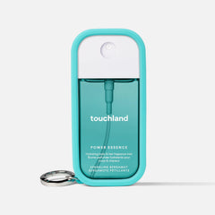 Touchland Azure Blue case on bag clip demonstrates easy access and travel-friendly fragrance visibility.