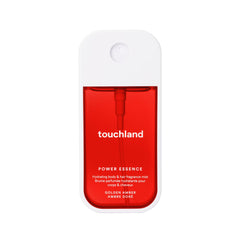 Touchland Golden Amber bottle closeup showcasing warm floral fragrance for daily use