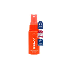Tower 28 SOS facial spray bottle closeup showing fragrance-free soothing mist for sensitive skin