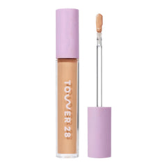 Tower 28 Swipe Serum Concealer tube closeup showing hydrating formula for sensitive skin.