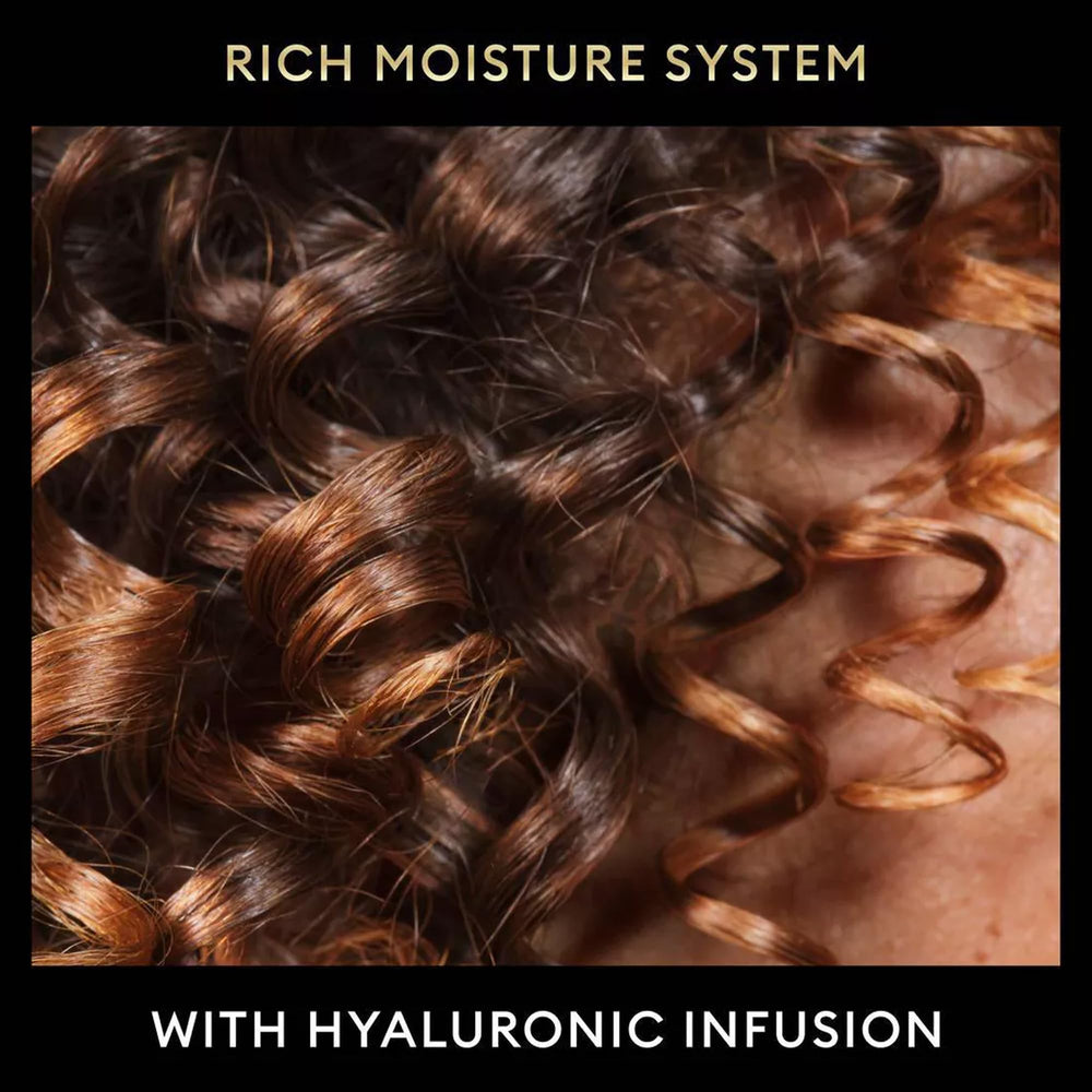TRESemmé Travel Frizz-Control hair close-up shows smooth, touchable finish.