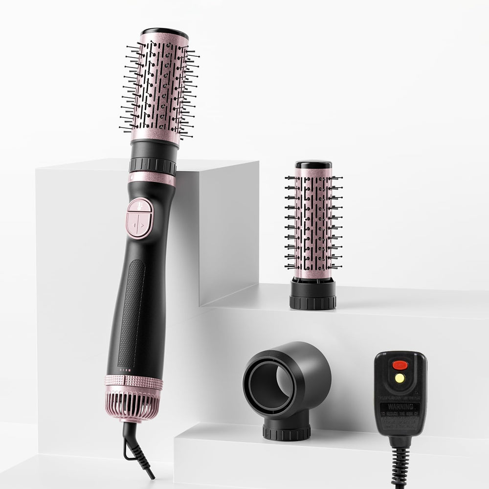 Tresses Touch blow dryer brush front view showing compact ergonomic handle for easy styling.