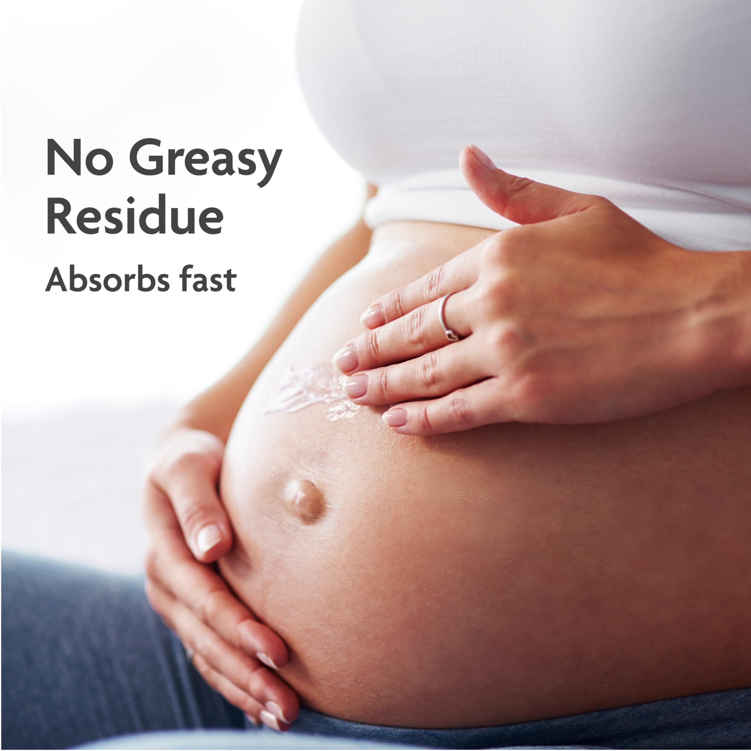 TriLASTIN stretch-mark cream texture non-greasy hand swirl shows quick absorption.