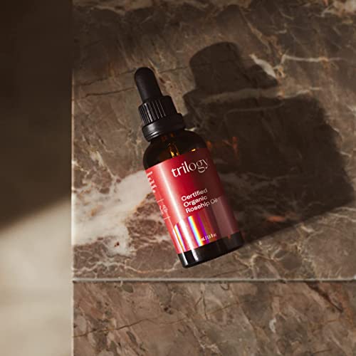 Trilogy rosehip oil dropper close-up emphasizing purity and easy controlled application.