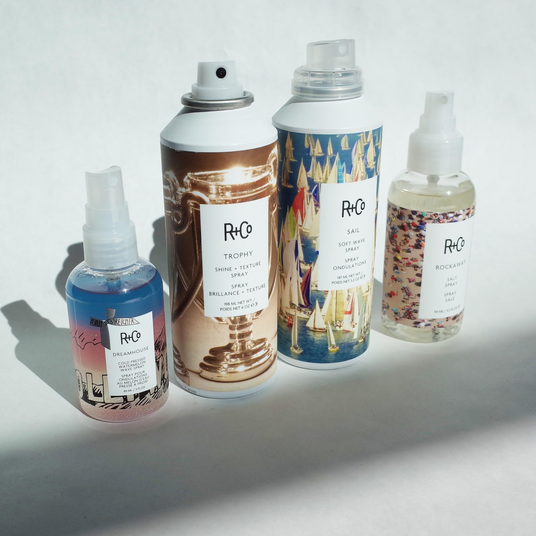 R+Co Trophy Shine Texture Spray suitable for all hair types, versatile styling.