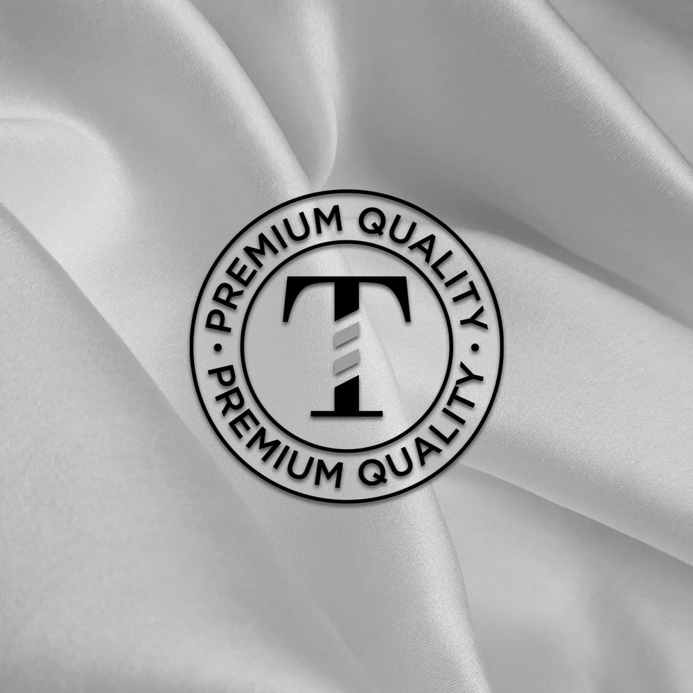 TRU BARBER white salon cape in use for a professional service.