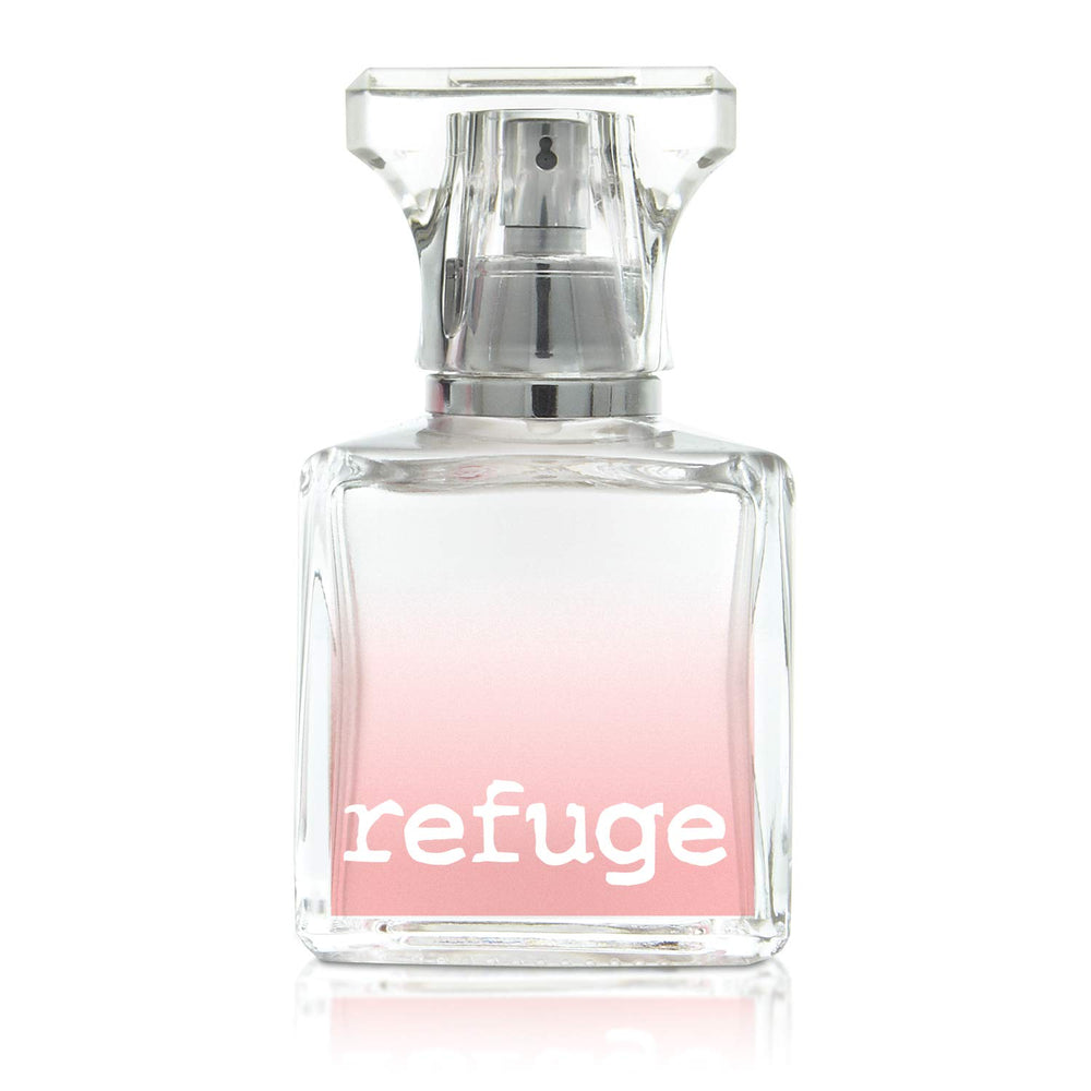 Charlotte Russe Refuge spray captured mid-application for quick refreshment.