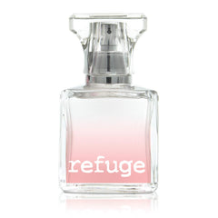 Charlotte Russe Refuge spray captured mid-application for quick refreshment.