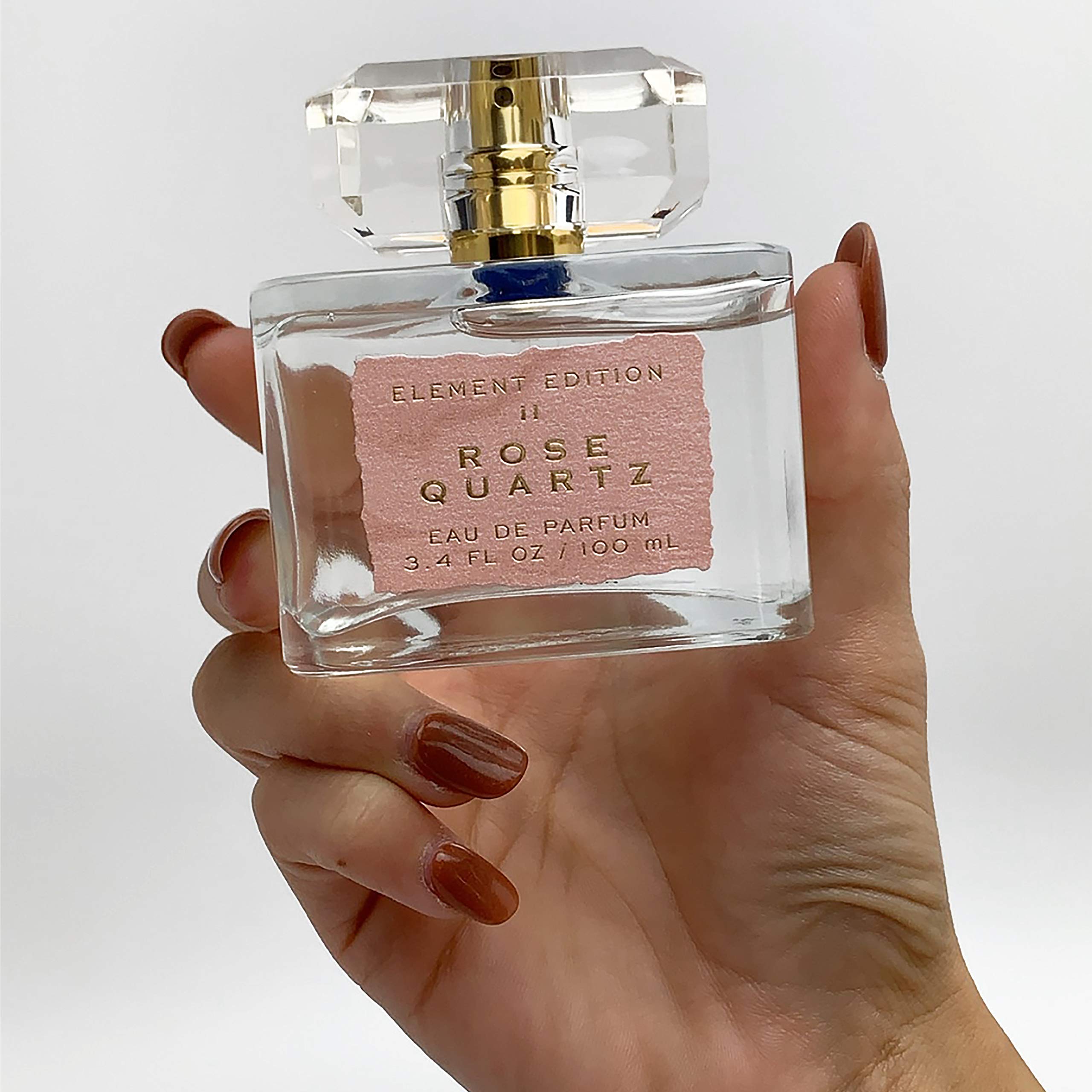 Tru Fragrance Beauty Element Edition Rose Quartz cap adds gold accent for a premium look.