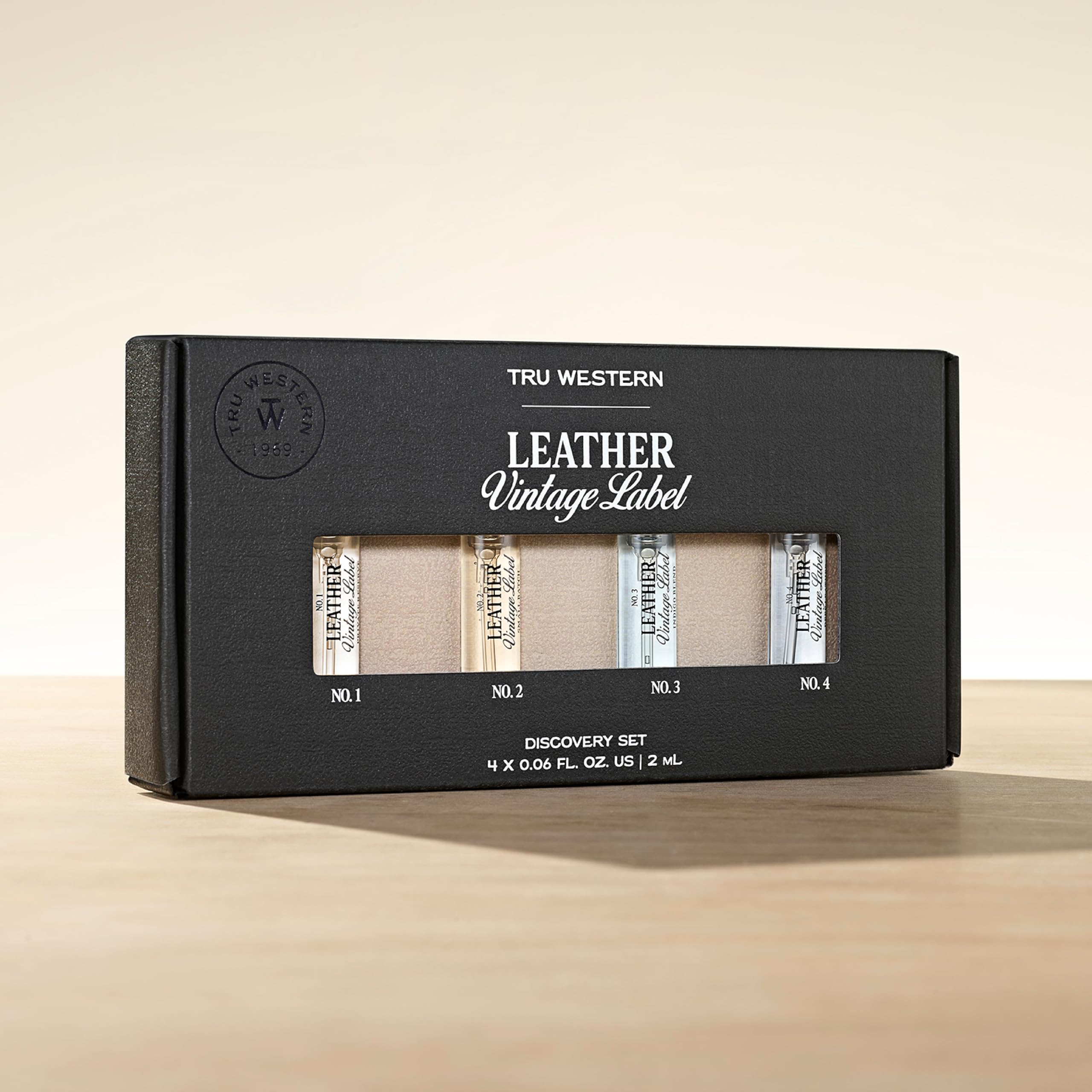 Tru Fragrance Leather Vintage Label No.3 Indigo Blend bottle blends citrus, vetiver, and suede sandalwood.